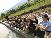 CUHK students catch fish in fields of Guizhou to prepare local specialties